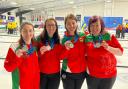 The Wales women's curling team with their medals