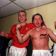 Steve Watkin and Mickey Thomas celebrate after Wrexham's win over Arsenal 31 years ago today