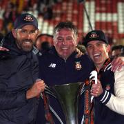 Wrexham co-owners Ryan Reynolds (left), Rob McElhenney (right) and manager Phil Parkinson (centre) celebrate promotion to the Sky Bet League 2 following the Vanarama National League match at The Racecourse Ground, Wrexham. Picture date: Saturday April