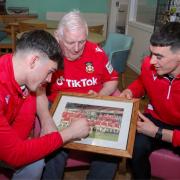 GOOD OLD DAYS: Former Wrexham captain Gareth Davies with current Reds' players Luke McNicholas and Liam Hall. Picture: WREXHAM AFC