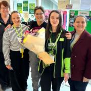 Leah Aldridge, from Connah's Quay, with the team at Asda Queensferry.