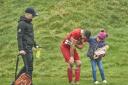 Six year old Lucy Gittins comforts Rhayader Town footballer Tony Davies after his injury on Saturday. Picture by Ian Francis.