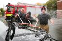 Firefighters in Holywell raise hundreds for the Firefighters Charity with a car wash. Pic: Holywell firefighters Anthony Devall, Timothy Wilkes and Ciarain O'Hagan washing cars for the Firefighters Charity. GA031118C.