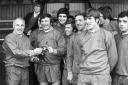File photo dated 07-05-1971 of Watched by his teammates, Liverpool captain Tommy Smith receives the Player of the Year trophy from manager Bill Shankly, awarded by Inside Football magazine. PRESS ASSOCIATION Photo. Issue date: Friday April 19, 2019 Former