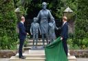 The Duke of Cambridge (left) and Duke of Sussex look at a statue they commissioned of their mother Diana, Princess of Wales, in the Sunken Garden at Kensington Palace, London, on what would have been her 60th birthday. Picture: PA