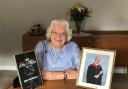Enid with her 2020 Teenage Cancer Trust Award, and a photo of her late grandson Richard