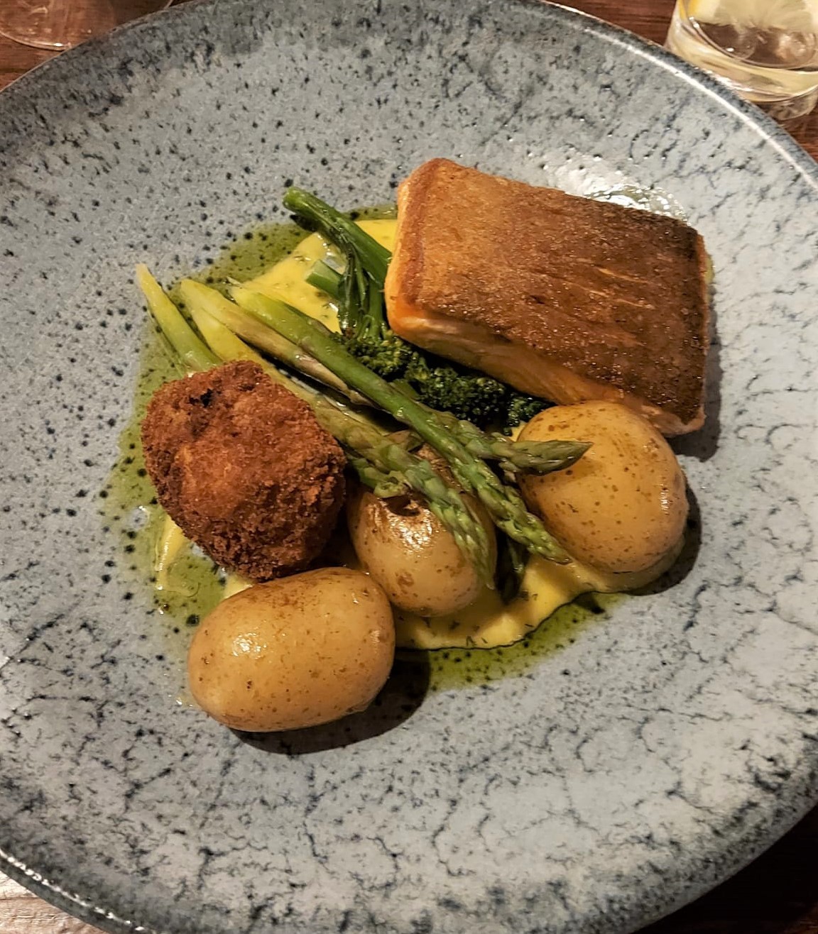 The Hideout Bistro & Bar, Rossett - pan fried Scottish salmon supreme with wilted spinach, dressed new potatoes, asparagus, crispy coated egg and dill hollandaise sauce.