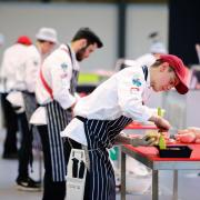 Butchers showing their skills at a previous competition.