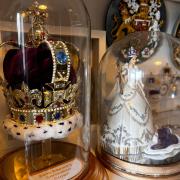 A replica of Saint Edwards Crown, made by Paul Smith and a figurine of Queen Elizabeth.