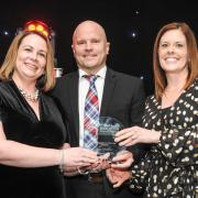 Emma Curtis (left) and Sian Salisbury (right) with Alex Fraser from Findel Education