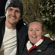 Wrexham superfan Millie Tipping with Harry Maguire in Wrexham.