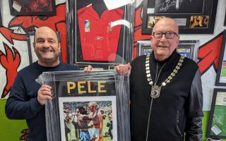 Mayor with Andy Nicholls of The Mancave with the donated Pelé and Bobby Moore photograph.