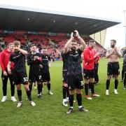 Wrexham players applaud their fans at Crewe. Picture: PA