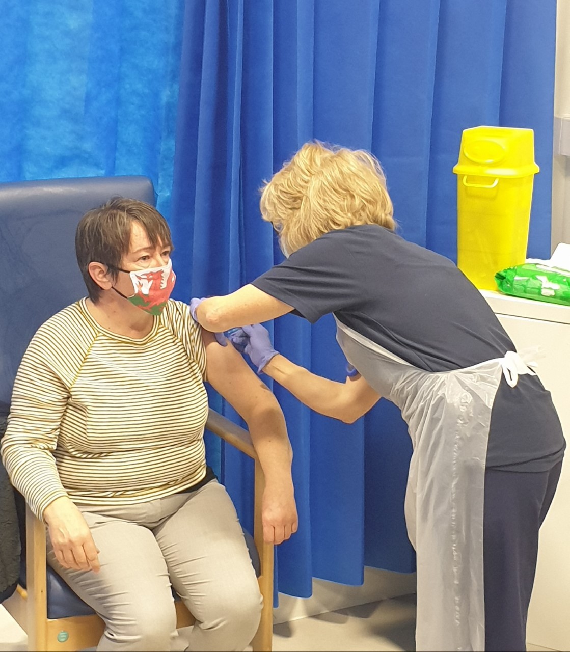 A vaccination takes place at Venue Cymru in Llandudno.