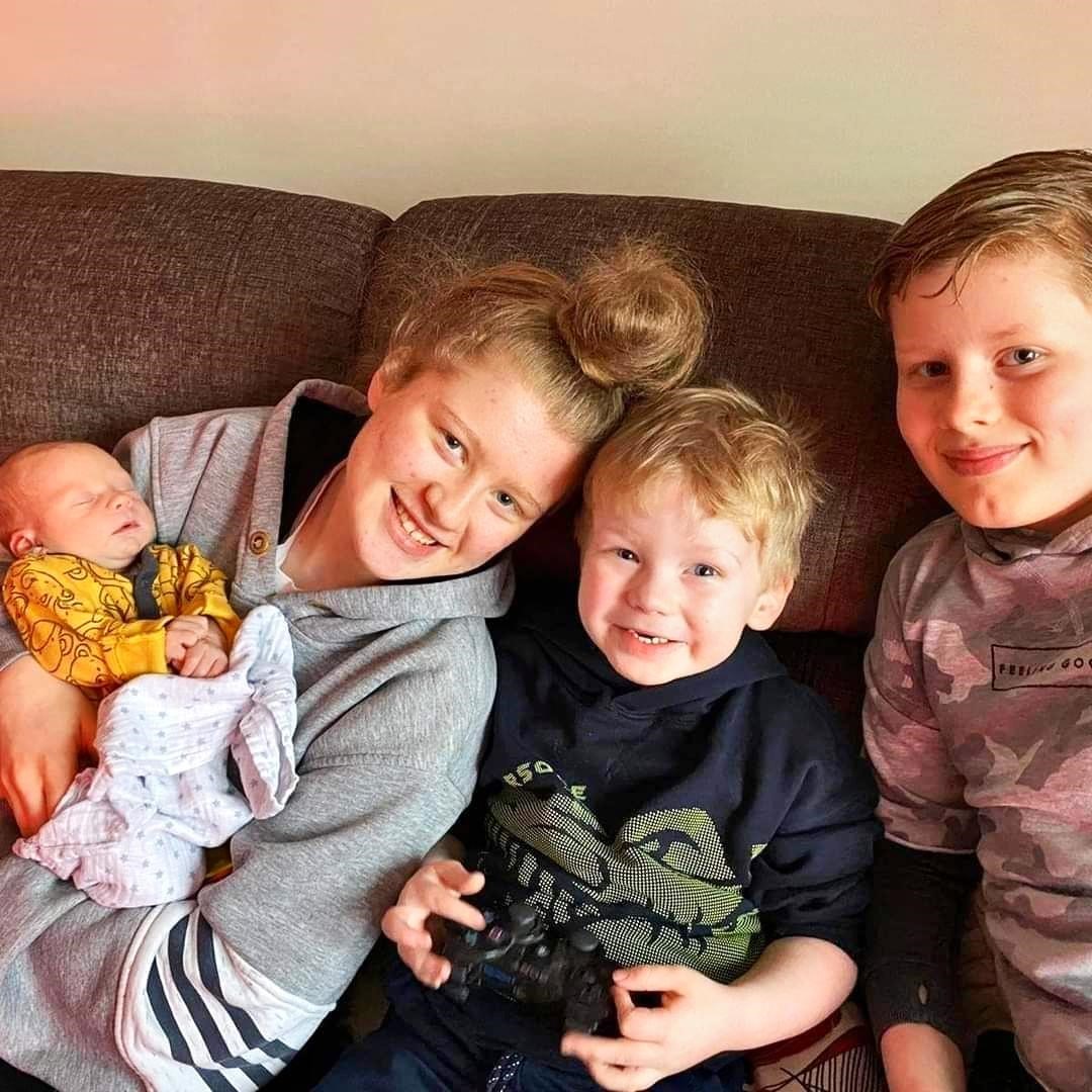 Megan, Tomos and Freddie with new baby brother Harri.