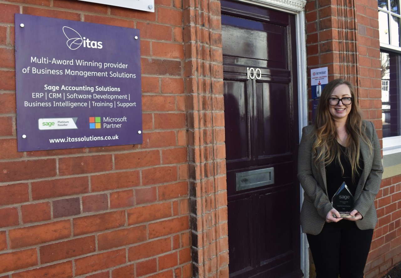 Hannah Munro is pictured outside the Itas Solutions premises on High Street, Mold