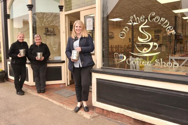 The Leader: Tracy Jones and Heather Smith, co-owners of On the Corner Café in Caerwys, with Hannah Blythyn Member of the Senedd for Delyn and their Naked Takeaway tiffin tins. (Photo courtesy of Phil Jones)