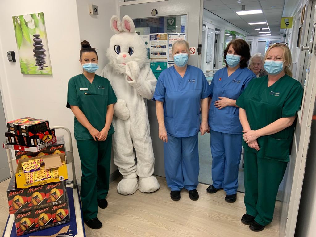 The Easter Bunny with staff at Mold Community Hospital.