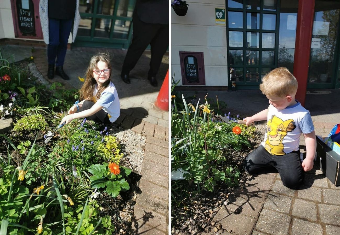 Evie and Sonny plant flowers at Ronald McDonald House. 