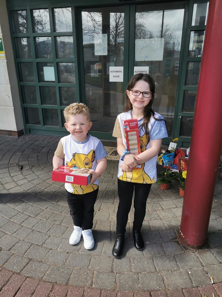 Sonny and Evie with some of the toys they donated to Ronald McDonald House. 