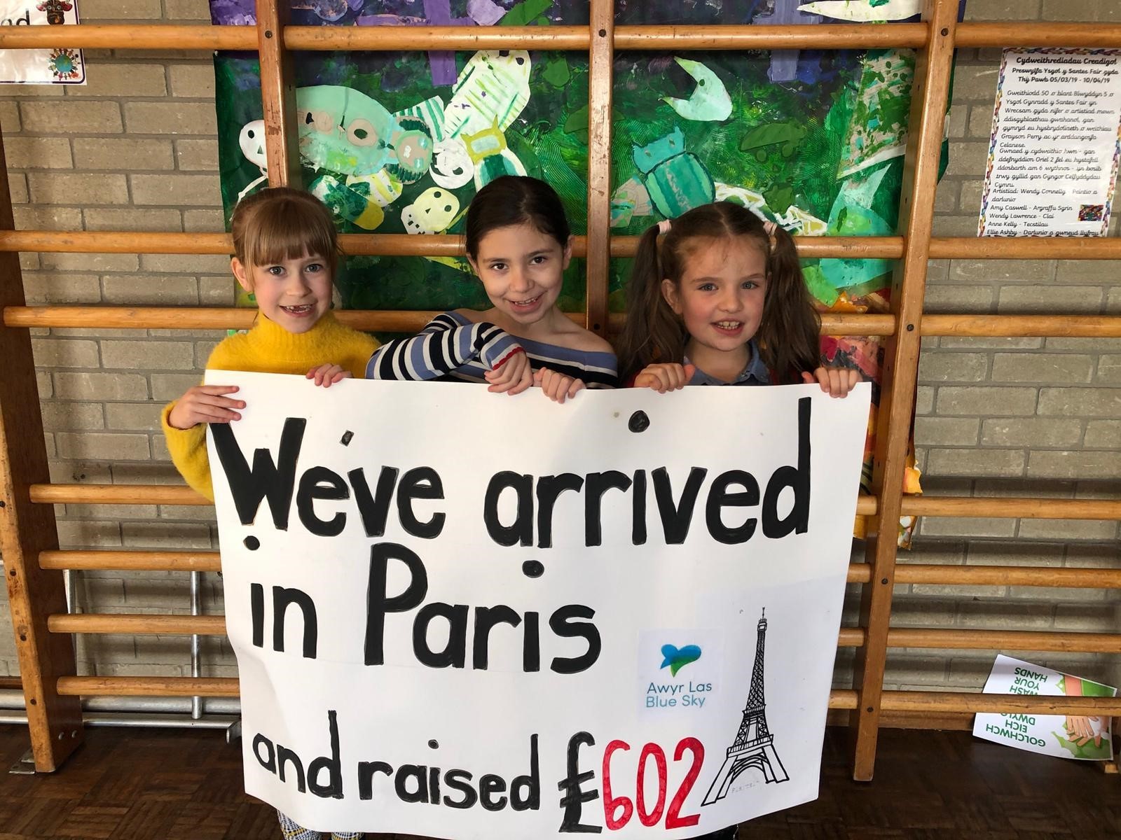 Rosie Crawford, Lilly Jones and Alicja Zawadzka, of St Marys RC School in Wrexham, announce the completion of the pupils virtual walk from Wrexham to Paris.