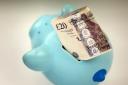 File photo dated 06/01/15 of money in a piggy bank. Women affected by changes to the state pension age are set for a High Court fight against the Government.