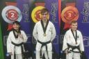 (L-R) Deeside Taekwondo's Casey Foster, James Harvey and John Davies with their medals.