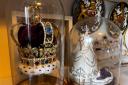 A replica of Saint Edwards Crown, made by Paul Smith and a figurine of Queen Elizabeth.