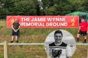 Main image of Jack Sargeant MS and Ben Wynne with the new banner at the ground / Inset of Jamie Wynne.
