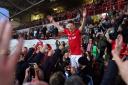 Wrexham striker Paul Mullin celebrates winning promotion