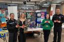 Inspector Claire McGrady, Detective Sergeant Vicky Keegans, Domestic Abuse Officer Andrea Greenwood and PCSO John Davies at Ty Pawb (North Wales Police)