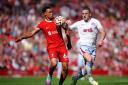Liverpool's Trent Alexander-Arnold (left) and Aston Villa's John McGinn battle for the ball during the Premier League match at Anfield, Liverpool. Picture date: Sunday September 3, 2023. PA Photo. See PA story SOCCER Liverpool. Photo credit