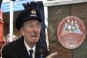 Actor and Holiday on the Buses star Stephen Lewis unveils a plaque commemorating the film at the holiday camp in 2004.