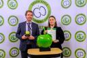 Redrow's sustainability director Garry Cornell collecting The Green Apple award from Renata Molnarova, JLL senior sustainability manager.