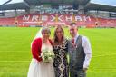 The happy couple, Chris and Debbie Robberts, on their wedding day at the Wrexham AFC racecourse with Amy Dowden