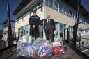 Supt Jon Bowcott , North Wales Police, and Ashley Rogers,  Chair of North Wales Police and Community Trust (PACT) with bagfuls of seized stolen property