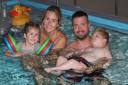 The Saunders family enjoy a hydrotherapy session at Hope House with son Oliver (right)