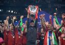 Liverpool manager Jurgen Klopp lifts the trophy with his team after winning the UEFA Champions League Final at the Wanda Metropolitano, Madrid.