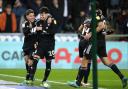 Fulham's Neco Williams (second left) celebrates scoring their side's fourth goal of the game during the Sky Bet Championship match at the Swansea.com Stadium, Swansea. Picture date: Tuesday March 8, 2022..