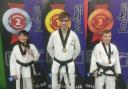 (L-R) Deeside Taekwondo's Casey Foster, James Harvey and John Davies with their medals.
