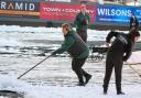 The snow clear-up process taking place at the Racecourse.