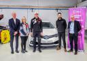 EV lecturer Charles Jones with Natalie Morris, senior specialist at Toyota, handing over the keys to an EV vehicle donated by the manufacturer during an event attended by World Rally Racing driver Elfyn Evans, Jason Stanley, general manager of Toyota GB