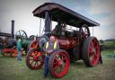 Vale Vintage Machinery Show chairman Meredudd Davies in front of a Burrell traction engine.