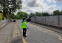 A PCSO in a keep clear zone outside a school.