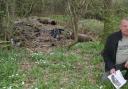 Cllr Paul Pemberton pictured in 2005 inside the area now fenced off around Llwyneinion Acid Tar Lagoon during his campaign to clean up the site.