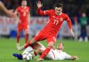 Wales' Tom Lawrence (left) and Denmark's Henrik Dalsgaard battle for the ball during the UEFA Nations League, Group B4 match at the Cardiff City Stadium.