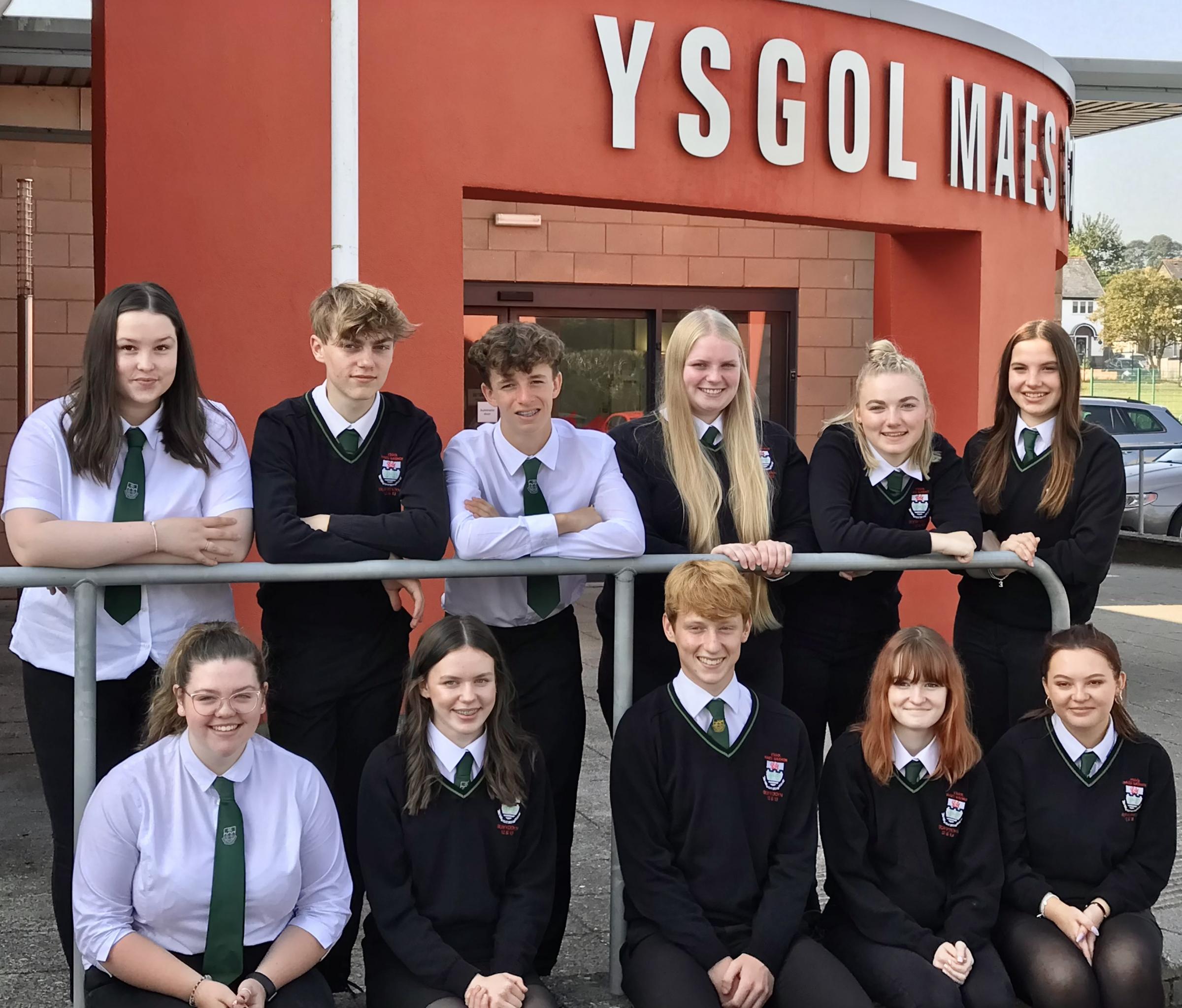 Ysgol Maes Garmon head pupils Cameron and Casi with members of Sixth Form forum - Lydia, Isobel, Henry, Sion, Elen, Catrin, Honey, Eleanor and Caitlin.