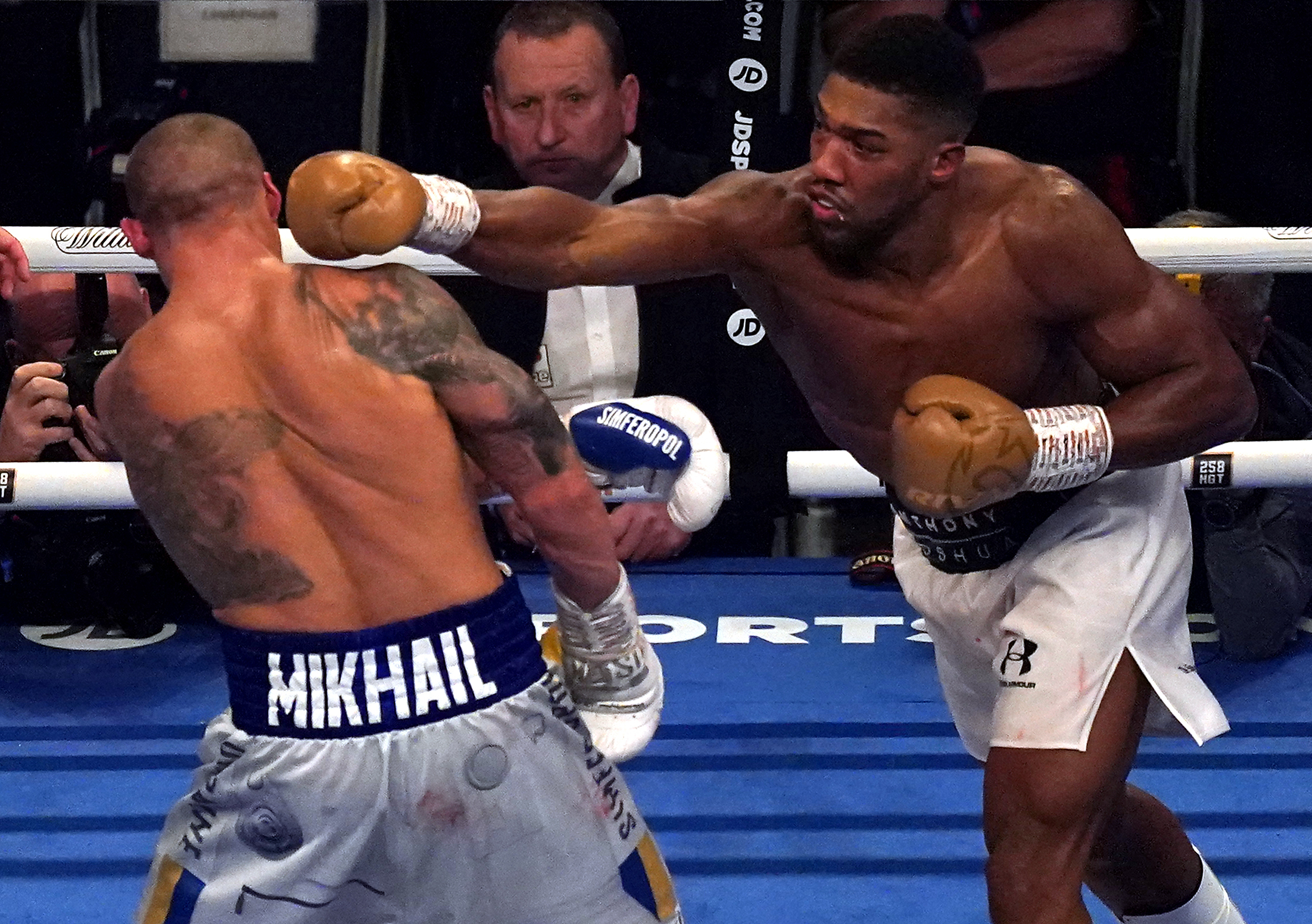 Anthony Joshua attempts a punch on Oleksandr Usyk in the WBA, WBO, IBF and IBO World Heavyweight titles match at the Tottenham Hotspur Stadium. Picture date: Saturday September 25, 2021.