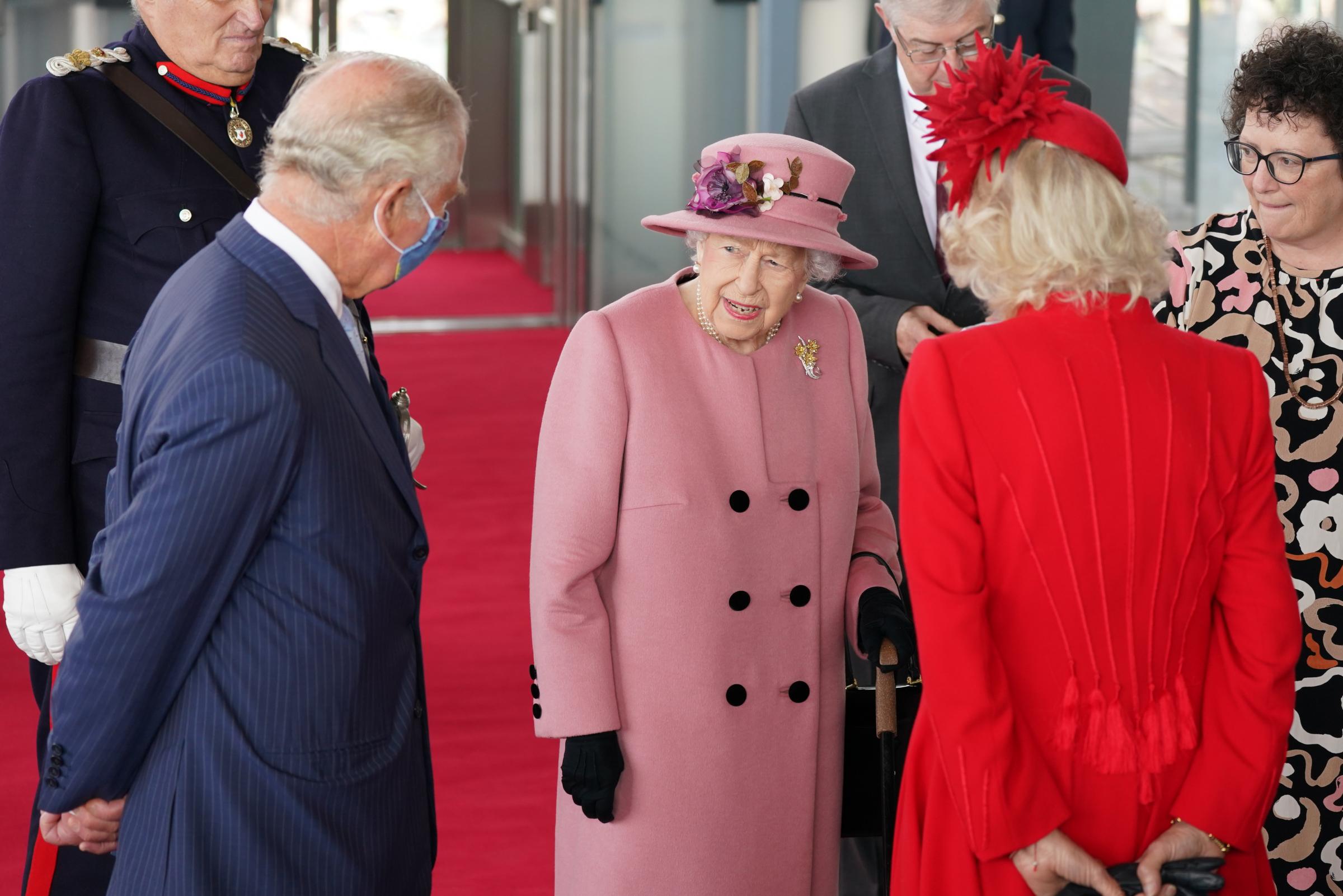 Queen Elizabeth II, accompanied by the Prince of Wales and Duchess of Cornwall attend the opening ceremony of the sixth session of the Senedd in Cardiff. Picture date: Thursday October 14, 2021.