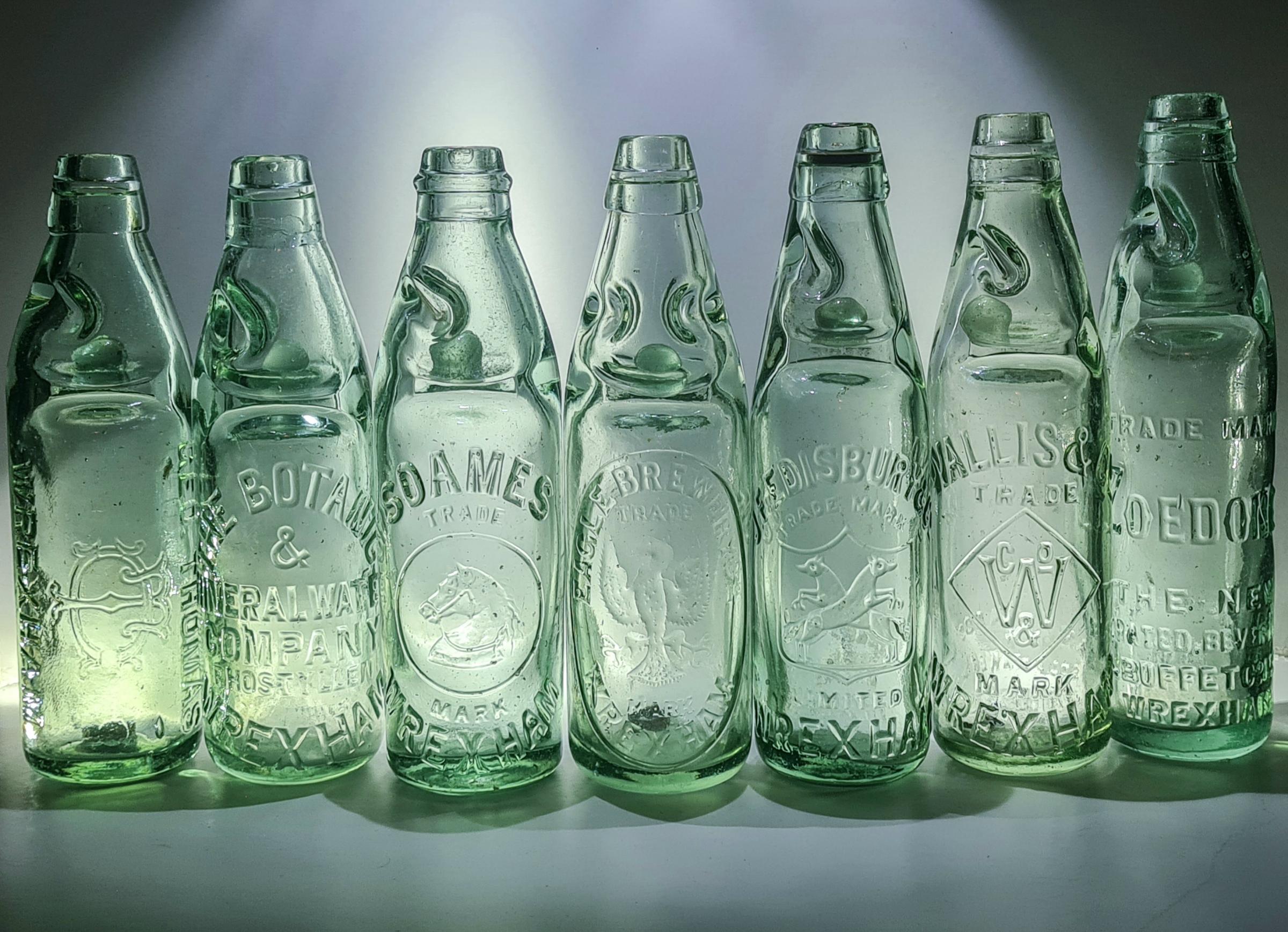 Wrexhams 10oz codd bottles of Adam Mercer, including the J.F Edisbury & Co. (third from the right).